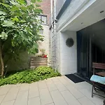 Lounge In The Intimate Urban Garden At A Retro Getaway